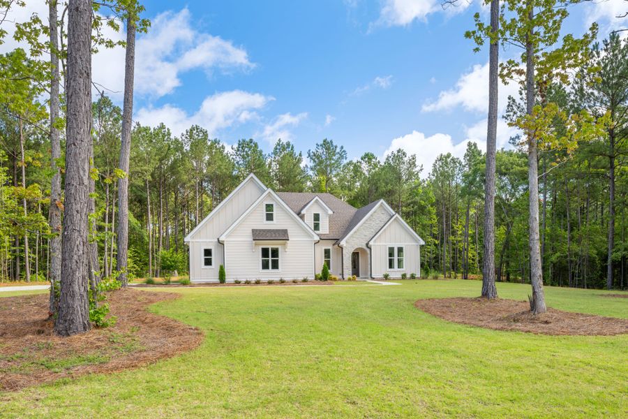 Front exterior of a new home in Flint Farms, Concord, GA, highlighting curb appeal (Image 1).