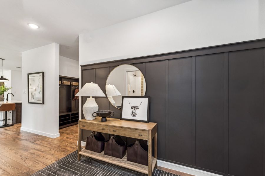 Foyer with decorative wall trim