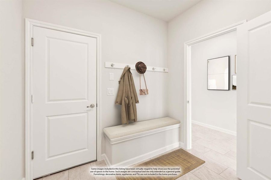 Mudroom entryway with wall coat hooks, built-in bench, and light tile flooring
