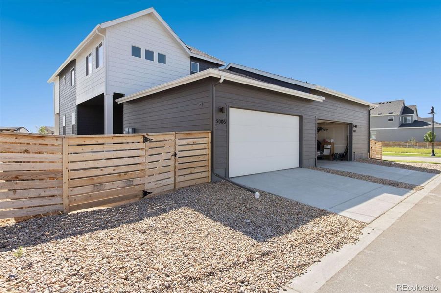 Exterior details and patio area of a home in Trailside on Harmony, Timnath (Image 24).