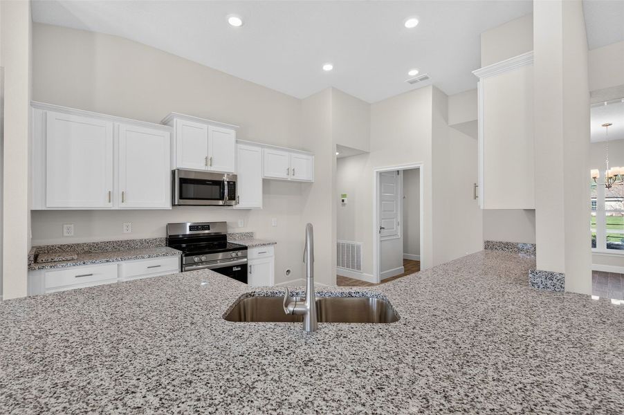 Furnished interior view inside a new home in Hill Country Estates, Dade City (Image 6).