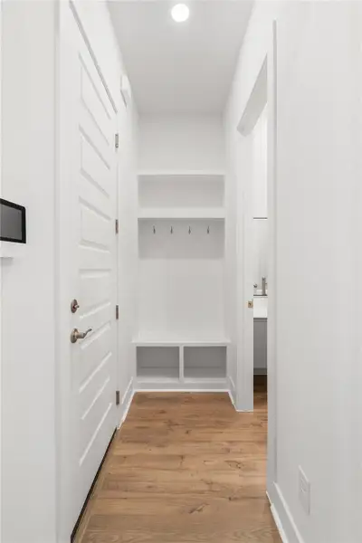 A room entry offers built-in storage and convenient hooks, creating an organized drop zone. A room entry offers built-in storage and convenient hooks, creating an organized drop zone.