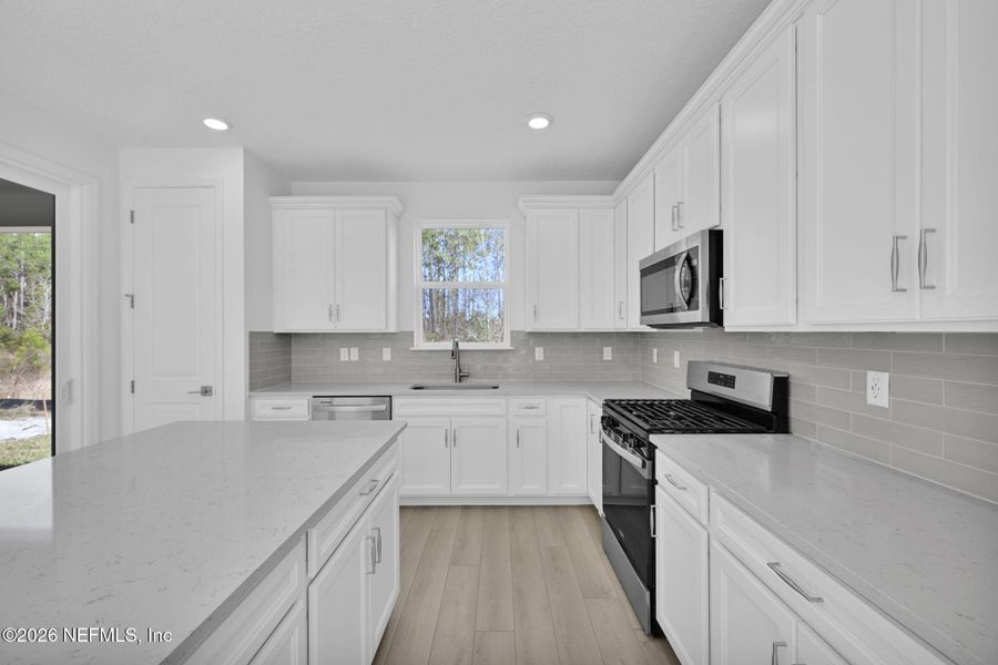Furnished interior view inside a new home in Del Webb Wildlight, Yulee (Image 9).