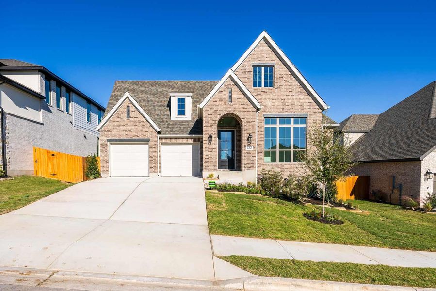 Front exterior of a new home in Lariat 60', Liberty Hill, TX, highlighting curb appeal (Image 1). Front exterior of a new home in Lariat 60', Liberty Hill, TX, highlighting curb appeal (Image 1).