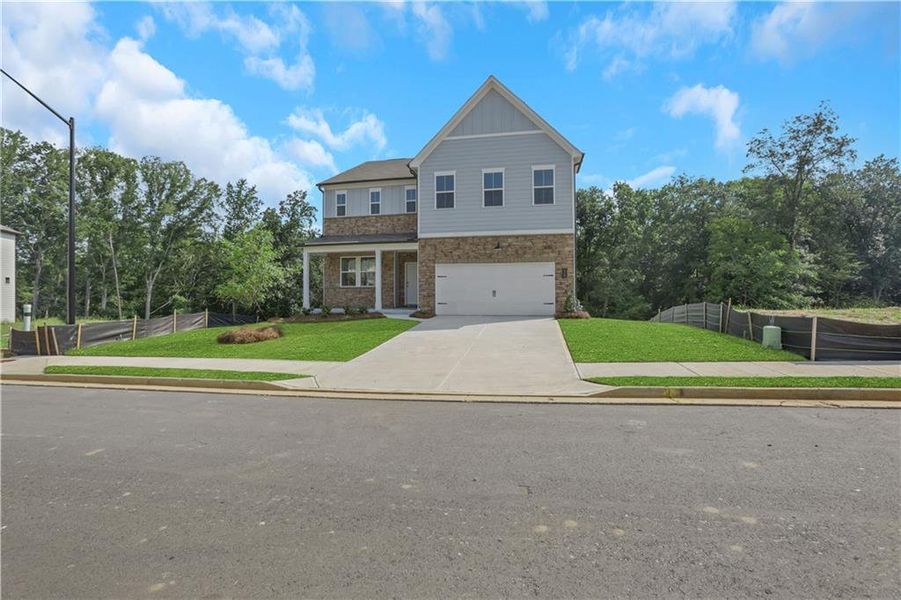 Front exterior of a new home in Easton Walk, Lawrenceville, GA, highlighting curb appeal (Image 2). Front exterior of a new home in Easton Walk, Lawrenceville, GA, highlighting curb appeal (Image 2).