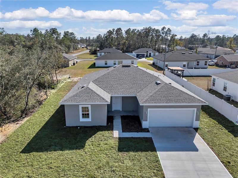 Front exterior of a new home in , Ocala, FL, highlighting curb appeal (Image 1). Front exterior of a new home in , Ocala, FL, highlighting curb appeal (Image 1).
