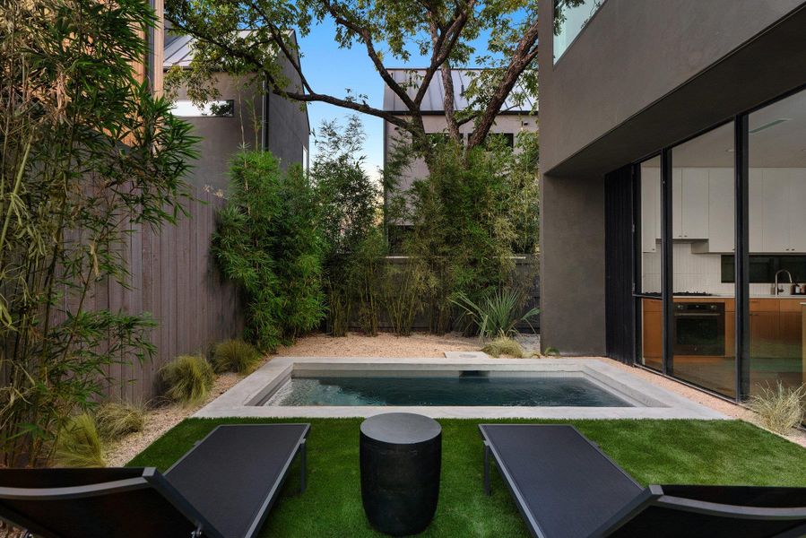 View of swimming pool with a fenced backyard and patio surround View of swimming pool with a fenced backyard and patio surround