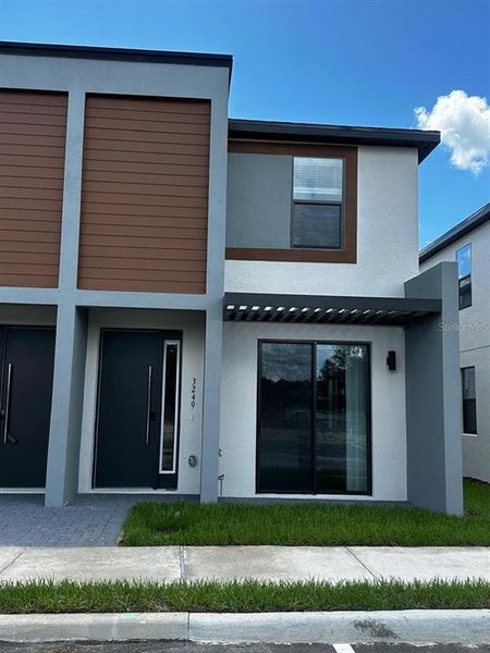 Front exterior of a new home in , Kissimmee, FL, highlighting curb appeal (Image 1). Front exterior of a new home in , Kissimmee, FL, highlighting curb appeal (Image 1).