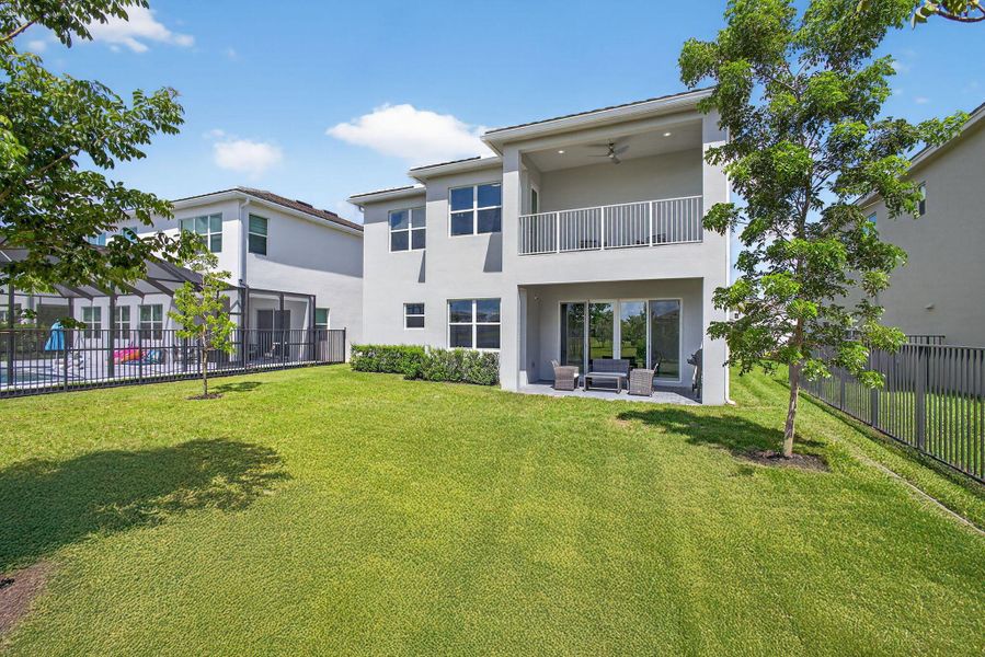 Front exterior of a new home in , The Acreage, FL, highlighting curb appeal (Image 27).