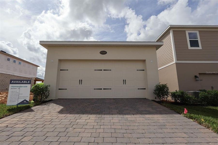 Exterior details and patio area of a home in Lake Star at Ovation, Winter Garden (Image 4).