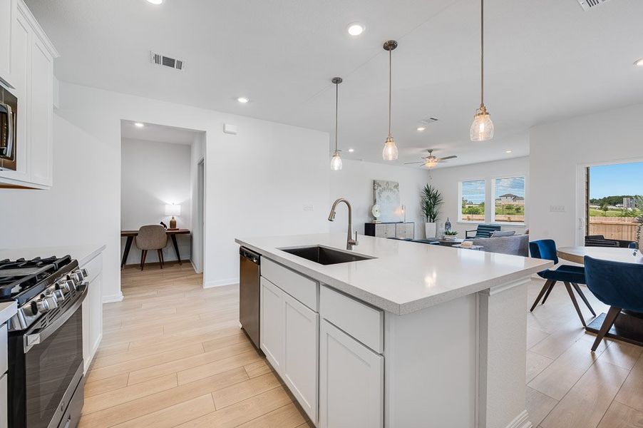 Representative furnished interior of a home built from the Sparrow by Taylor Morrison in Turner's Crossing 50s, Austin (Image 6).