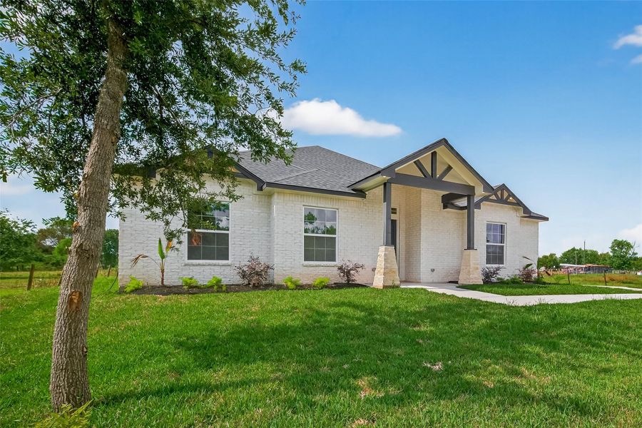 Front exterior of a new home in , Hitchcock, TX, highlighting curb appeal (Image 23).