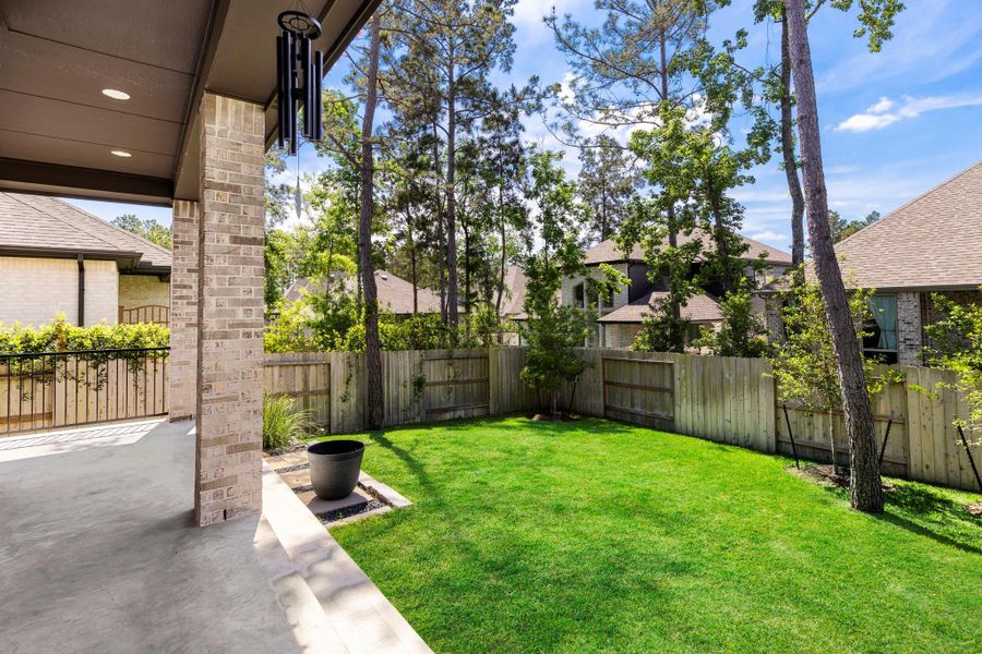 Exterior details and patio area of a home in Woodforest, Montgomery (Image 28).