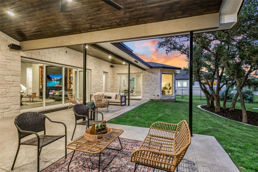 Patio terrace at dusk with outdoor lounge area and a patio area Patio terrace at dusk with outdoor lounge area and a patio area