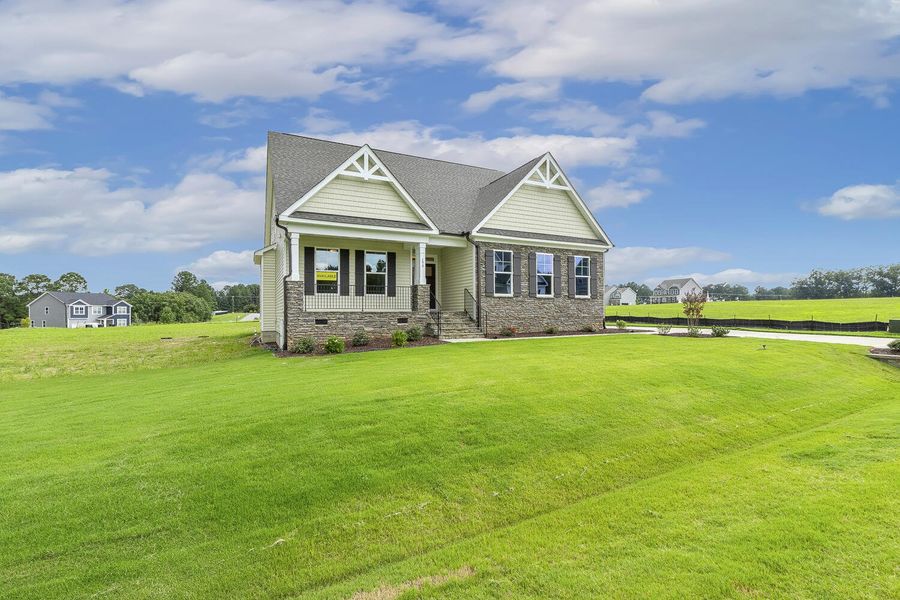 Front exterior of a new home in Berea Farms, Four Oaks, NC, highlighting curb appeal (Image 22).