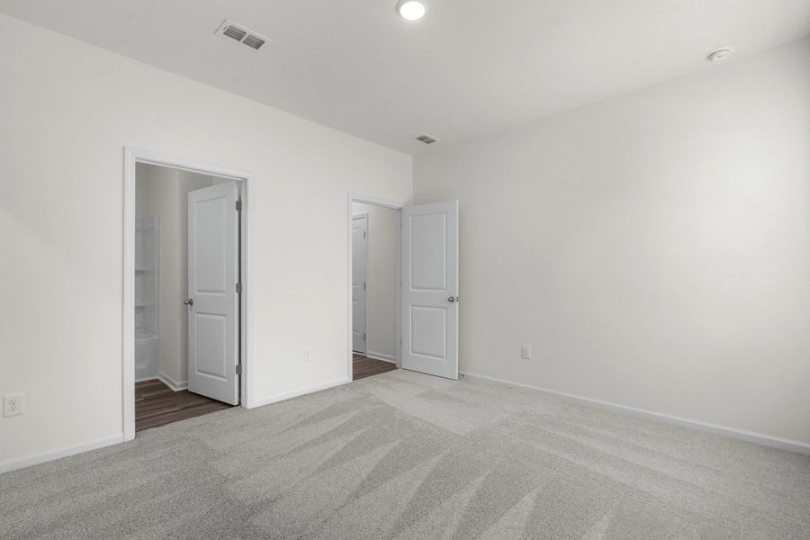 Representative unfurnished interior of a home built from the Europa by Starlight Homes in Oakfield Lakes, Parrish (Image 17).