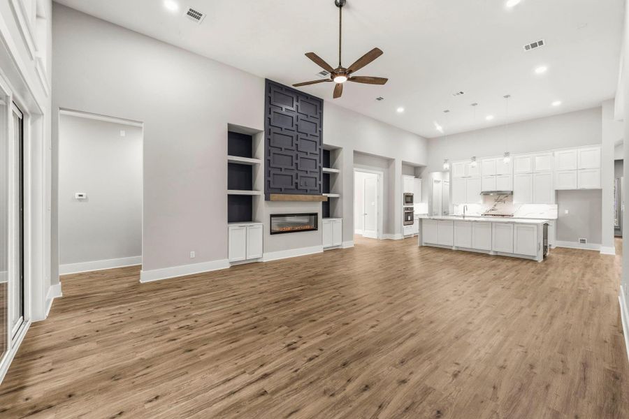 From this angle, the scale of the main living area really shines, bringing the kitchen, fireplace, and gathering spaces together in one cohesive design.