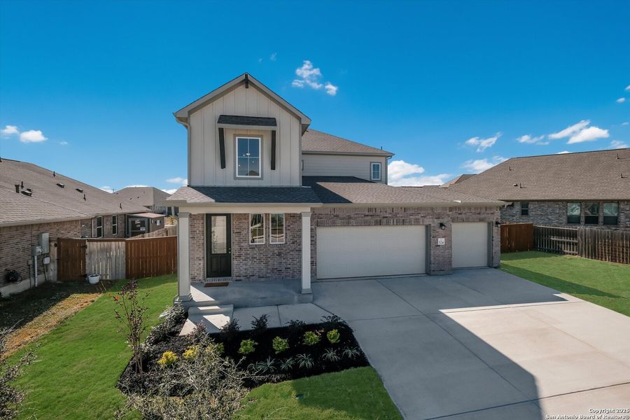Front exterior of a new home in Foxbrook, Schertz, TX, highlighting curb appeal (Image 1).