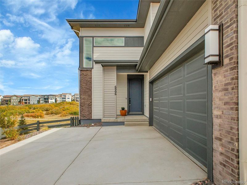 Exterior details and patio area of a home in Wild Oak at The Canyons, Castle Pines (Image 2). Exterior details and patio area of a home in Wild Oak at The Canyons, Castle Pines (Image 2).