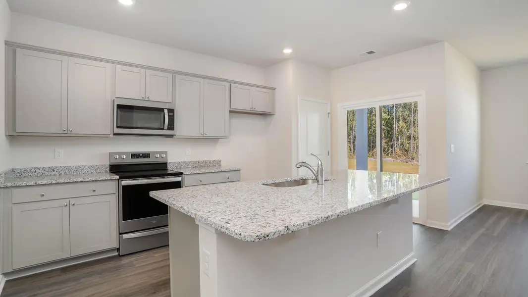 Representative furnished interior of a home built from the KERRY by D.R. Horton in Sandridge Park, Little River (Image 5).