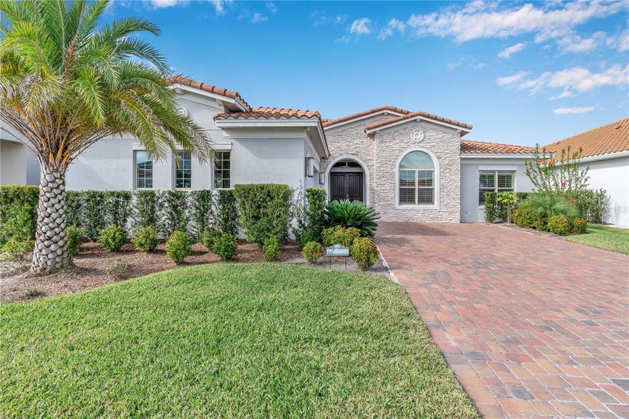 Front exterior of a new home in , Orlando, FL, highlighting curb appeal (Image 1). Front exterior of a new home in , Orlando, FL, highlighting curb appeal (Image 1).