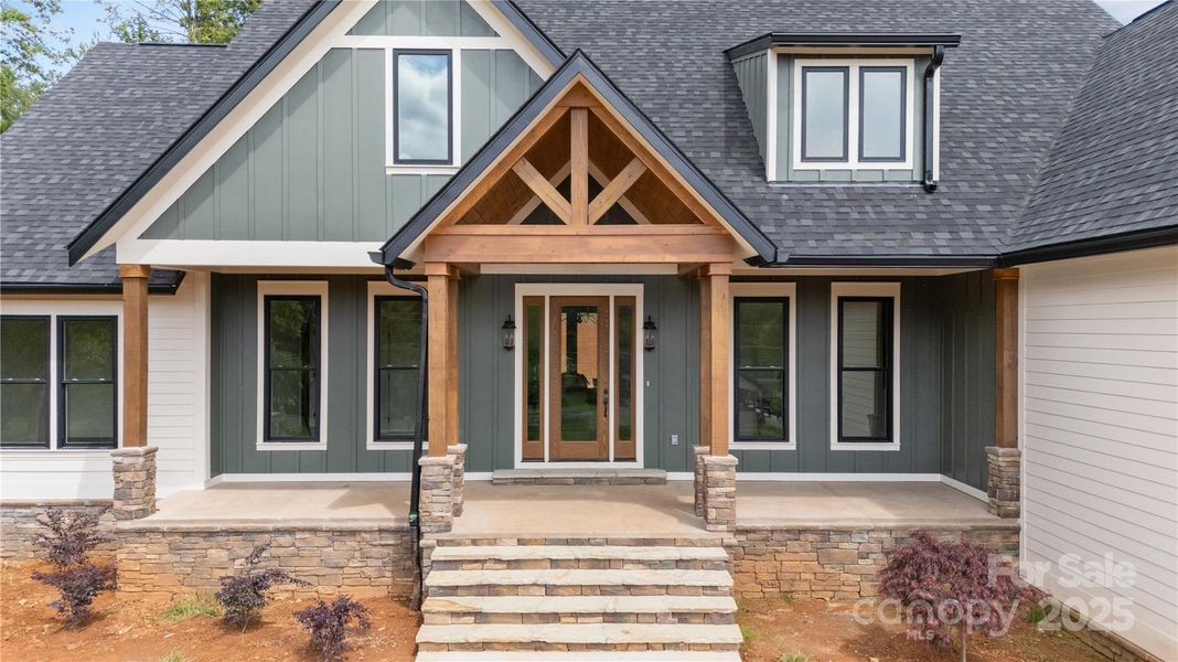 Front exterior of a new home in , Hendersonville, NC, highlighting curb appeal (Image 26). Front exterior of a new home in , Hendersonville, NC, highlighting curb appeal (Image 26).