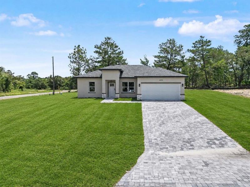 Front exterior of a new home in , Citrus Springs, FL, highlighting curb appeal (Image 22).