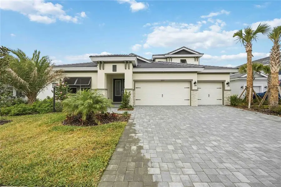 Front exterior of a new home in , Lakewood Ranch, FL, highlighting curb appeal (Image 2). Front exterior of a new home in , Lakewood Ranch, FL, highlighting curb appeal (Image 2).