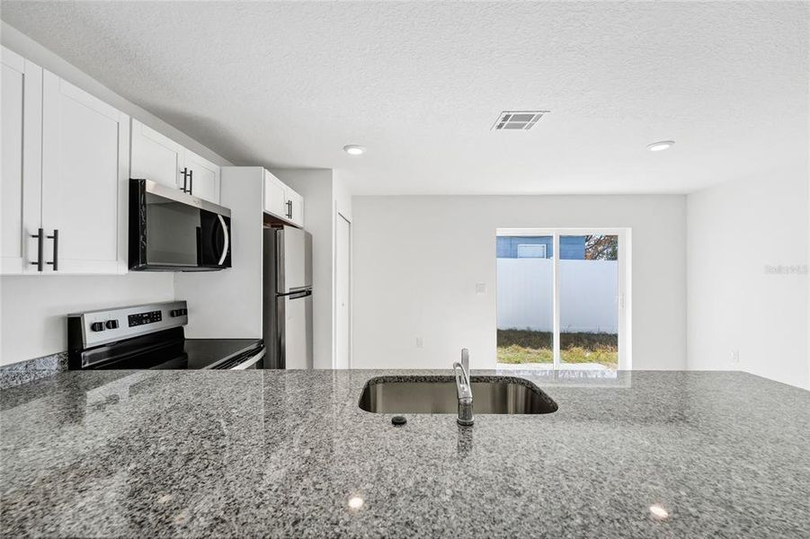 Furnished interior view inside a new home in , Haines City (Image 6). Furnished interior view inside a new home in , Haines City (Image 6).