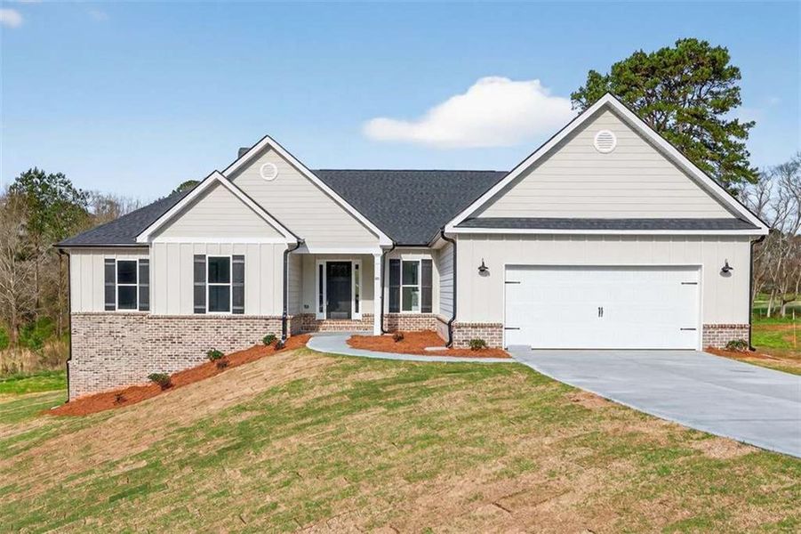Front exterior of a new home in , Winder, GA, highlighting curb appeal (Image 1). Front exterior of a new home in , Winder, GA, highlighting curb appeal (Image 1).