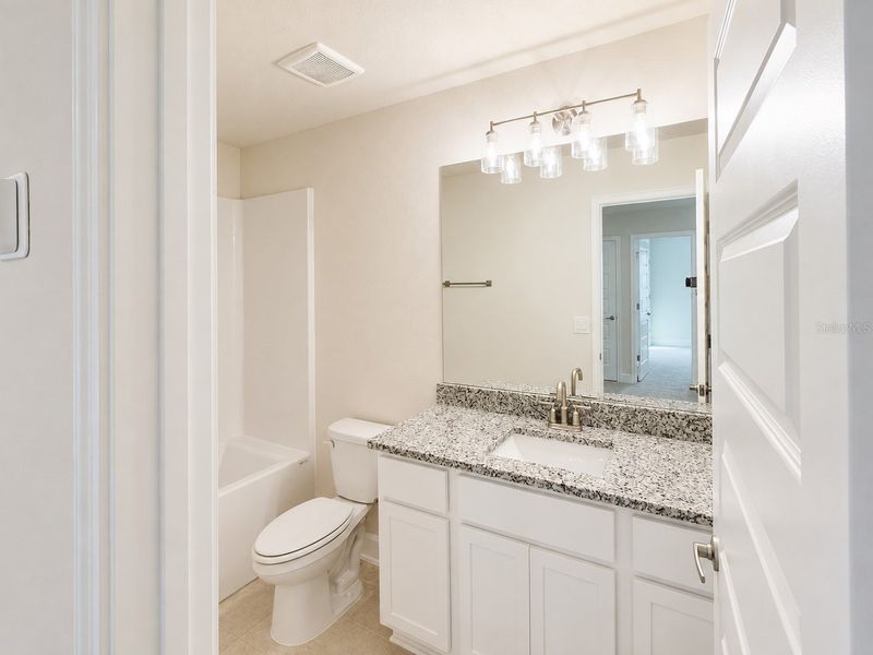 Furnished interior view inside a new home in Harmony Central, Harmony (Image 4).