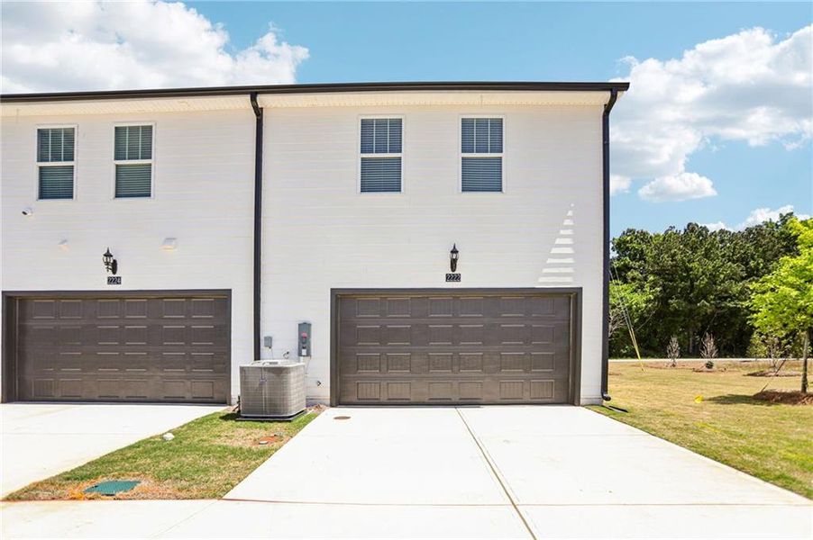 Front exterior of a new home in Avalon - Vista Series, Conyers, GA, highlighting curb appeal (Image 24).