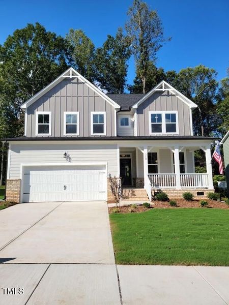 Front exterior of a new home in Tobacco Road, Angier, NC, highlighting curb appeal (Image 59). Front exterior of a new home in Tobacco Road, Angier, NC, highlighting curb appeal (Image 59).