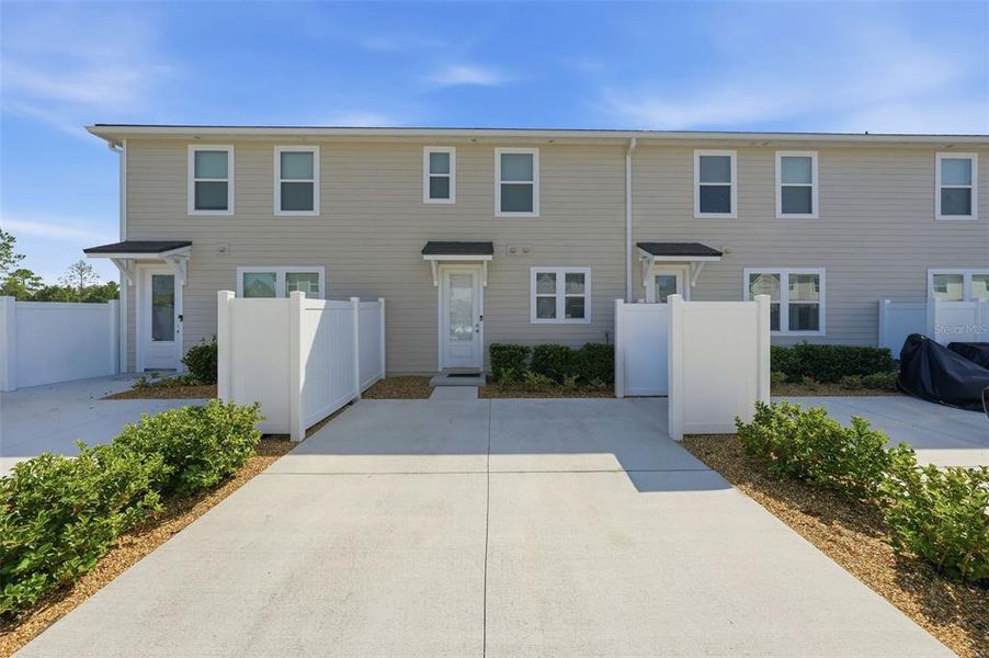 Front exterior of a new home in , St. Johns, FL, highlighting curb appeal (Image 2). Front exterior of a new home in , St. Johns, FL, highlighting curb appeal (Image 2).