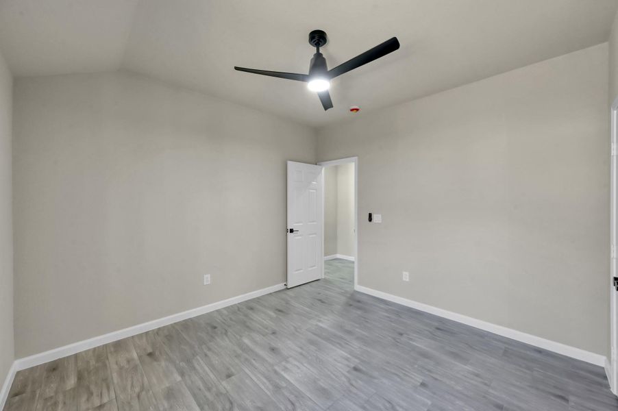 Space and versatility define this secondary bedroom. With ample square footage and a minimalist design, it’s the perfect canvas for a guest suite, nursery, or a dedicated home office.