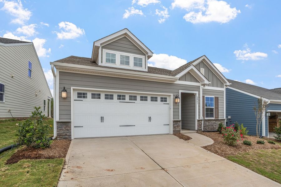Front exterior of a new home in Ovation at Sweetbrier, Durham, NC, highlighting curb appeal (Image 20).