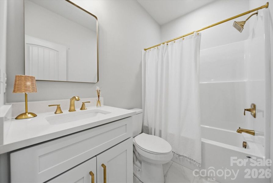 Guest Bathroom with gold hardware