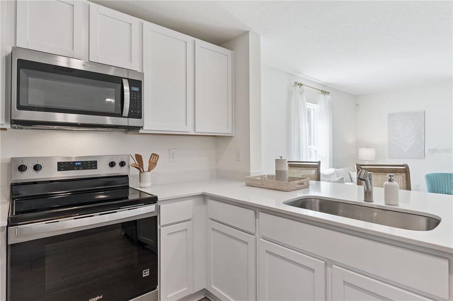 Furnished interior view inside a new home in Sandalwood, New Smyrna Beach (Image 14).