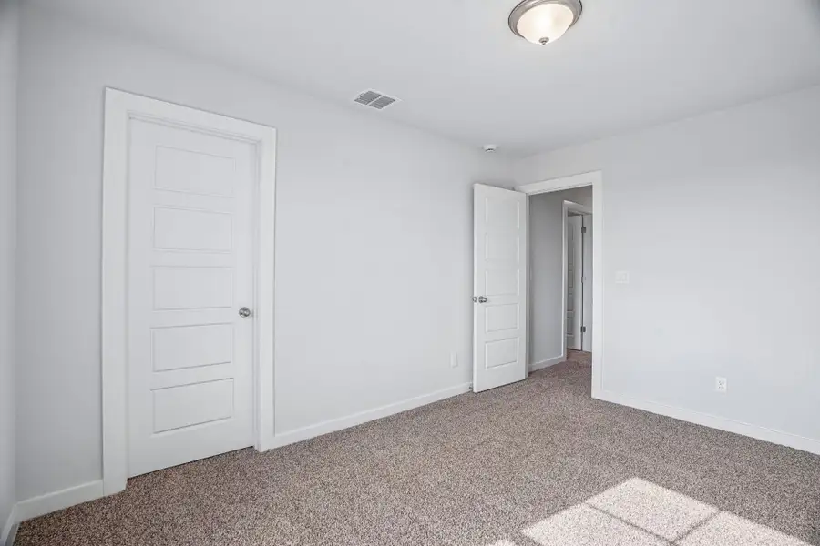 Spacious, unfurnished interior of a new home in The Meadows at Hunters Ranch, San Antonio (Image 36).