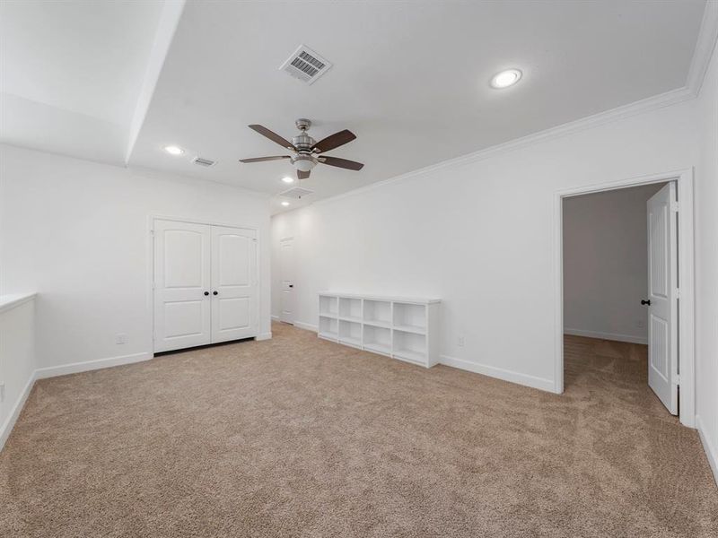 The Upstairs Gameroom with its built-in shelving, is the ultimate retreat for entertainment and showcasing your cherished collections. (Sample photos of a completed Warwick floor plan. The image may feature alternative selections and/or upgrades.)