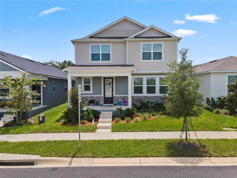 Front exterior of a new home in , Groveland, FL, highlighting curb appeal (Image 25).