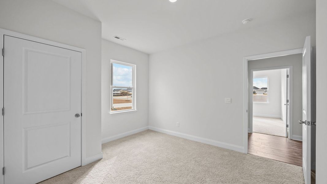 Spacious, unfurnished interior of a new home in Villa Grande, Winterville (Image 25).