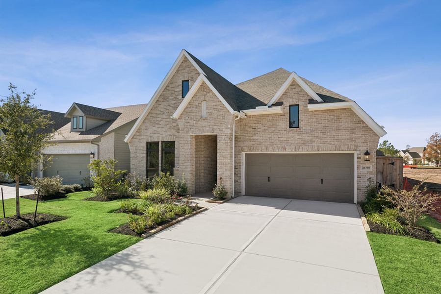 Front exterior of a new home in Kresston, Magnolia, TX, highlighting curb appeal (Image 25).