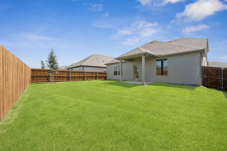 Covered Patio in the Haylee home plan by Trophy Signature Homes - REPRESENTATIVE PHOTO Covered Patio in the Haylee home plan by Trophy Signature Homes - REPRESENTATIVE PHOTO