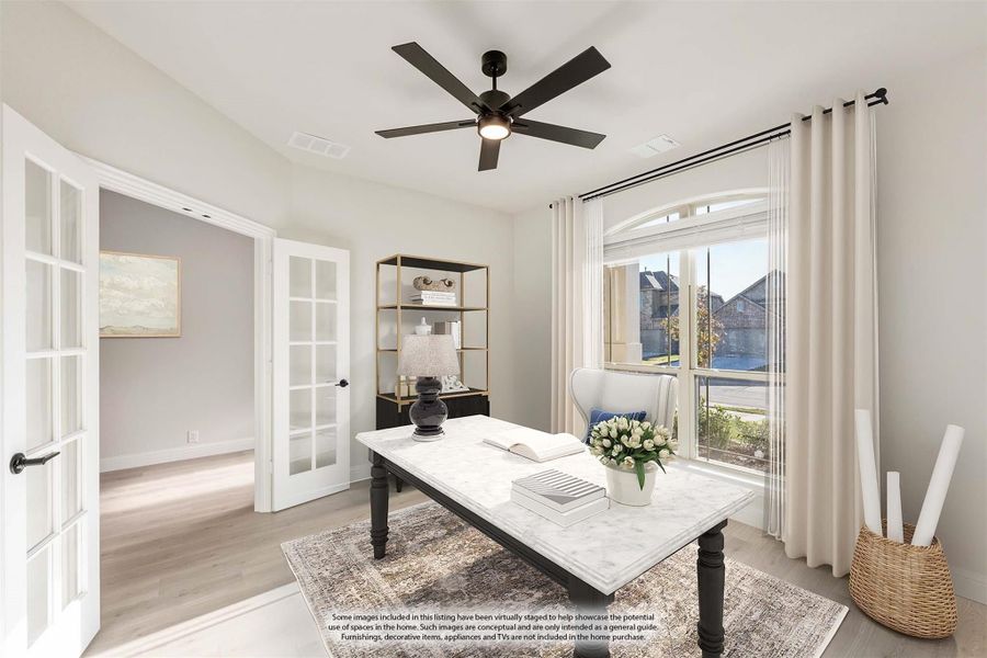 Home office with French doors, marble-top desk, ceiling fan, and arched window with natural light Home office with French doors, marble-top desk, ceiling fan, and arched window with natural light