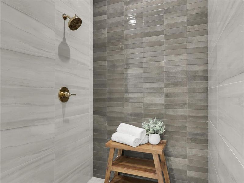 Bathroom featuring a tile shower