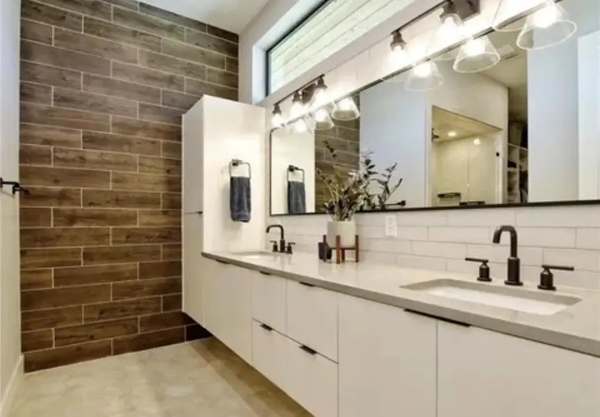 Bathroom featuring double vanity and a walk in shower Bathroom featuring double vanity and a walk in shower