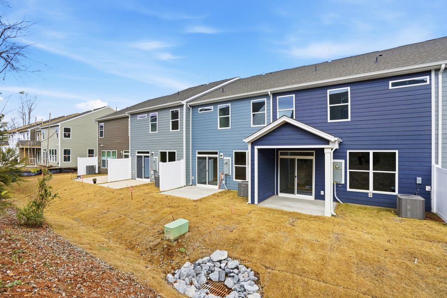 Exterior details and patio area of a home in Harrisburg Village Townhomes, Harrisburg (Image 25).