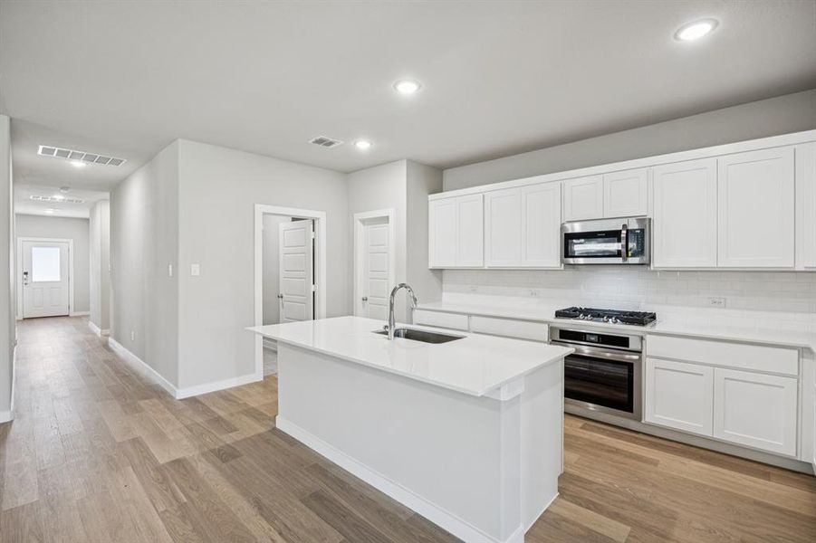 Kitchen in the Oscar home plan by Trophy Signature Homes – REPRESENTATIVE PHOTO Kitchen in the Oscar home plan by Trophy Signature Homes – REPRESENTATIVE PHOTO