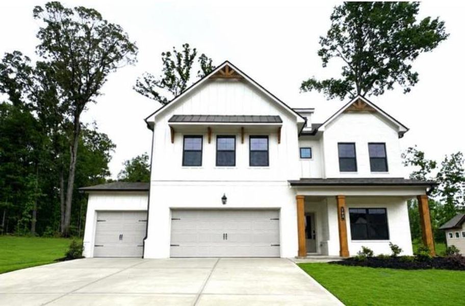 Front exterior of a new home in Rosewood Lake Preserve, Hoschton, GA, highlighting curb appeal (Image 20). Front exterior of a new home in Rosewood Lake Preserve, Hoschton, GA, highlighting curb appeal (Image 20).